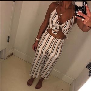 Blush/white/taupe striped cut-out jumpsuit